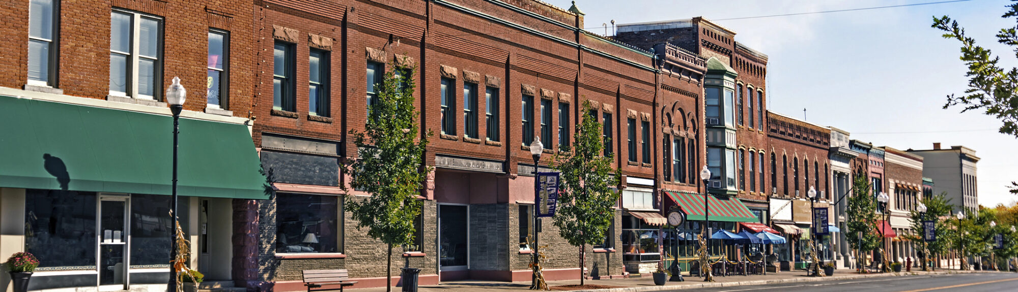 Historic downtown street with brick buildings and storefronts.